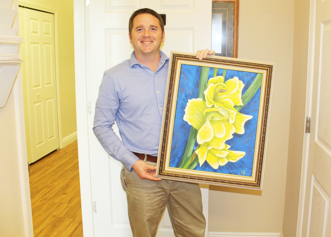 Dr. Herndon with a patient's painting